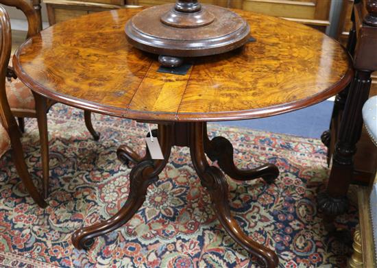 A late Victorian burr walnut Sutherland table, with oval double flap top and with gateleg action, 90cm x 110cm (open)